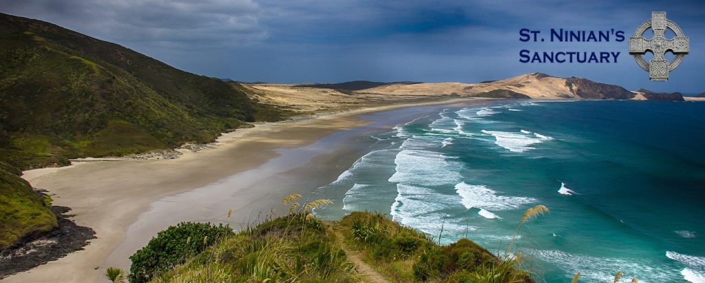 St. Ninian's logo on a stormy beach image