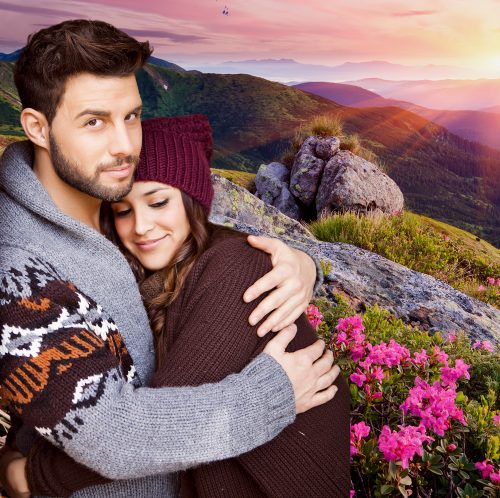 Couple embracing with a sunrise background